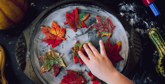 child making fall leaf cookies